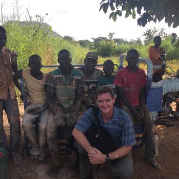 Philip with Children at the gold mine